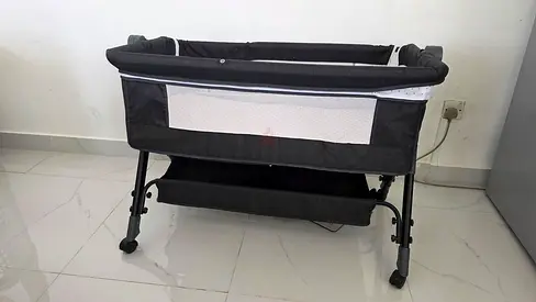 Black bedside bassinet / cradle with storage shelf - used
