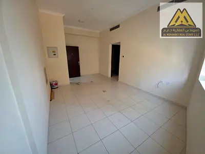 One-bedroom apartment with a living room for annual rent in Al Rashidiya 1, Ajman, in a prime location on the main road right next to the Orient Tower