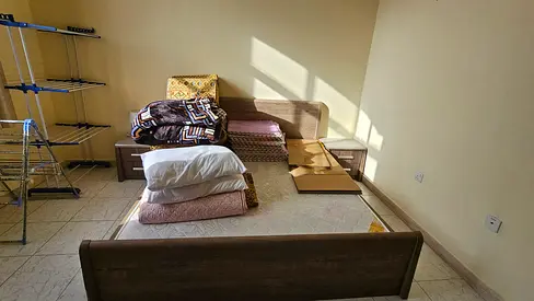 Queen-size wooden bed frame with mattress and bedside tables - good condition