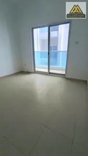 The apartment features a balcony, two bathrooms, a master bedroom, central AC, and free maintenance,