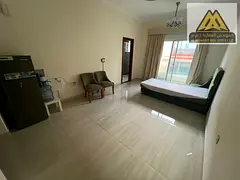 A fully furnished studio apartment with an exceptionally spacious layout,