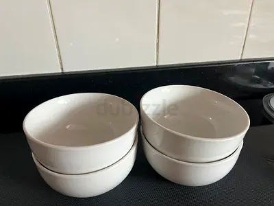 Set of 4 white ceramic serving bowls - good condition