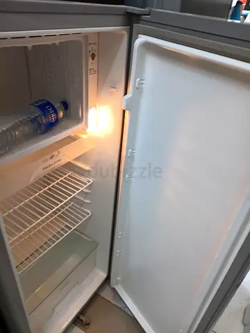 Compact single-door refrigerator with small freezer - good working condition