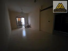 Al Nuaimiya 2-bedroom apartment with a spacious living room. • Separate living room with a practic