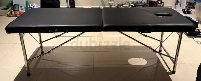Portable folding massage table