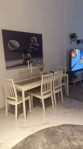 White wooden dining table with 6 chairs - good condition