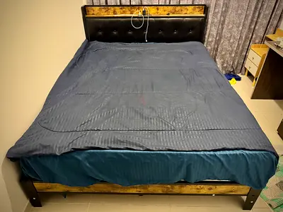 Queen size wooden bed frame with upholstered headboard - good condition