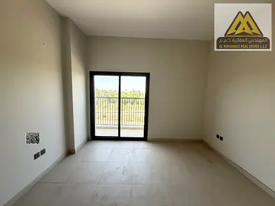 Two-bedroom apartment in Al Zahya with a balcony, three bathrooms, master bedroom, open kitchen, central A/C, gym, swimming pool, parking, garden, wal