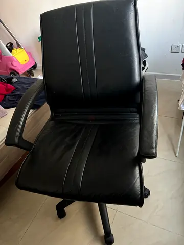 Black leather swivel office chair with armrests