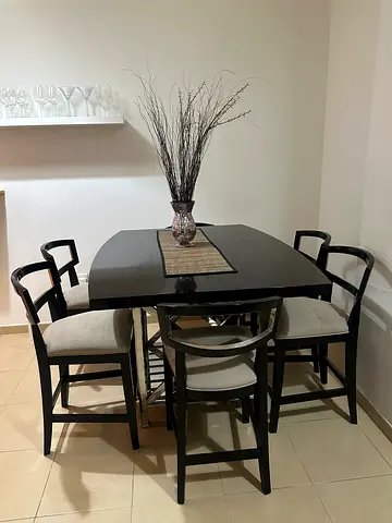 Black wooden dining table with 6 chairs