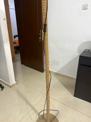 Tall rope-wrapped floor lamp with metal base