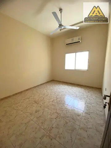 Studio in Al Rawda 3, large space, separate kitchen, split AC, AED 18k, 4 payments, main road.