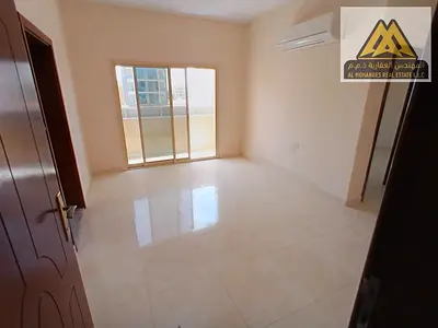 One-bedroom apartment with living room in Al Alia, Ajman. Balcony, suitable space, prime location close to services. AED 28,000 in 4 installments, com