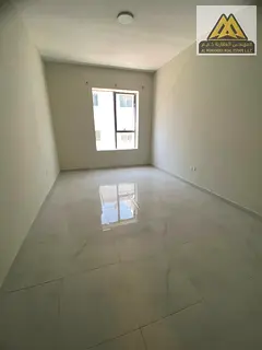 A spacious bedroom and living room with a practical design and ample space