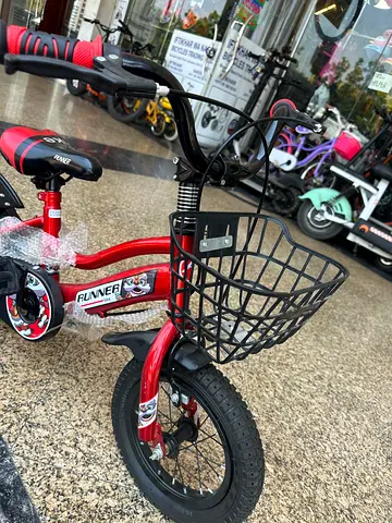 Red kids tricycle with front basket - like new