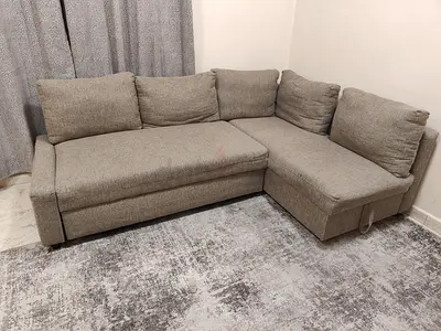 L-shaped grey fabric sofa with storage - good condition