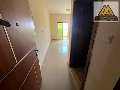 2-bedroom apartment with living room in Al Nuaimiya 2, Ajman, featuring 2 bathrooms, a balcony, and central AC. Spacious layout, annual rent AED 35,00