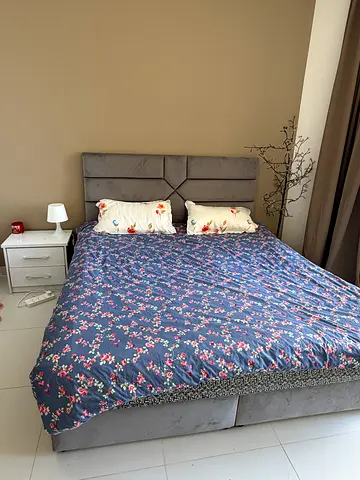 Grey upholstered double bed with headboard - good condition