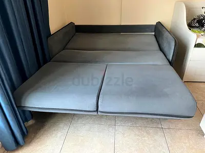 Grey convertible sofa bed — good condition, folds out to double bed