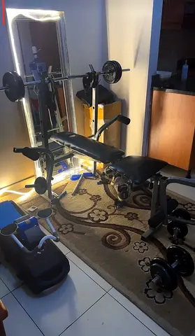 Home multi-function weight bench with barbell, dumbbells and leg curl