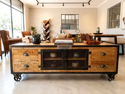 Industrial wooden TV/coffee console with metal mesh doors on wheels