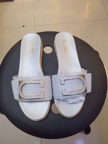 Silver slide sandals with decorative buckle, size 36