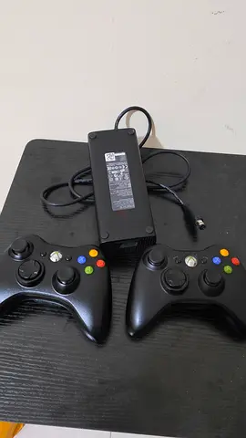 Xbox 360 E controller and power adapter