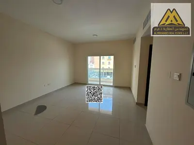 Upscale family apartment with a stunning view, built-in wardrobes, and free maintenance in one of the best locations in Al Nuaimiya, near Al Hikma Sch
