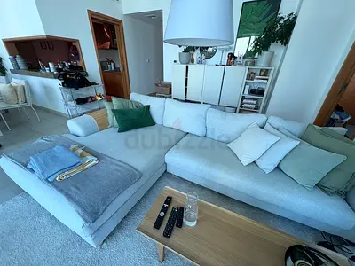 Light grey L-shaped fabric sofa with chaise - good condition