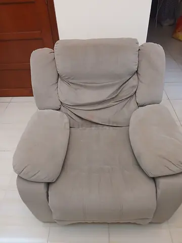 Comfortable grey single recliner armchair - average condition