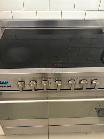 Bompani Stainless steel electric cooker with ceramic hob and oven controls