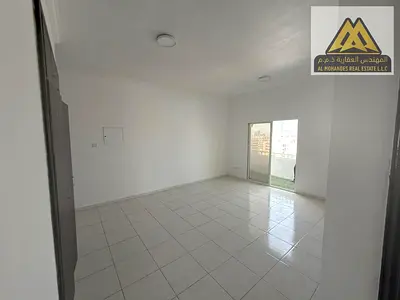 One-bedroom apartment with living room, balcony, and built-in wardrobes for annual rent Free parking | Central air conditioning |