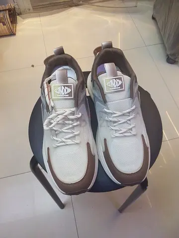 Light brown and white mens sneakers, lightly used