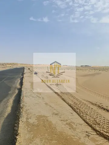 **Prime Plot for Sale in Al Sahmah** An excellent opportunity to own a premium plot in a strategic location in Al Sahmah. Situated on an 18-meter roa