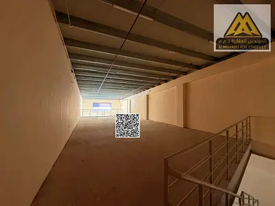 A commercial warehouse with huge operating spaces and a spacious mezzanine in the heart of Al Jurf Industrial Area, in a strategic location