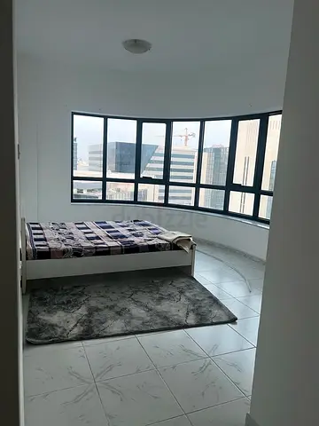 Queen bed with mattress and grey area rug - used, good condition