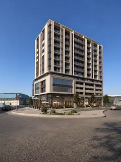 Commercial land for sale in Al Nahda (formerly Industrial Area 1) | Corner plot on a 36m wide main s