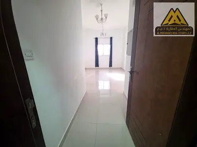 For annual rent in Rashidiya 3: 1-bedroom apartment with living room, second tenant, in a new and clean building with central AC. Prime location close