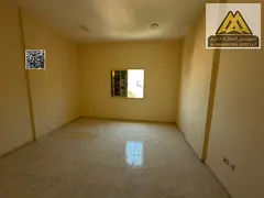 Studio in Al Rashidiya 2, large space, semi-separate kitchen, central AC. AED 18K yearly, 4 payments