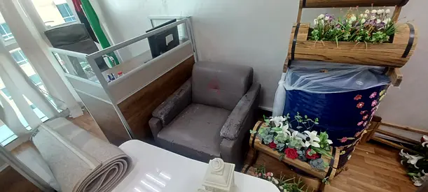 Two upholstered single armchairs and one upholstered three-person armchair, all in gray and in good