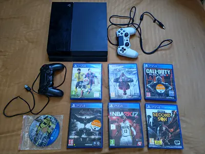 PS4 Console, 2 controllers and 7 games. All in good condition. Barsha 1, near MOE.