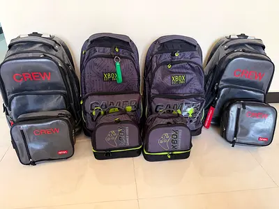 4 trolley school bags with 4 lunchboxes @ 100dhs only
