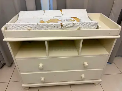 Used white baby changing table with drawers.