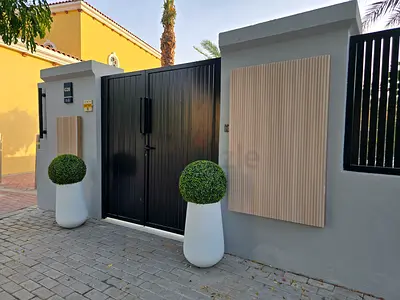 Entrance utility meter covers. Hide those ugly Dewa cabinets. — Modern slatted design with options.
