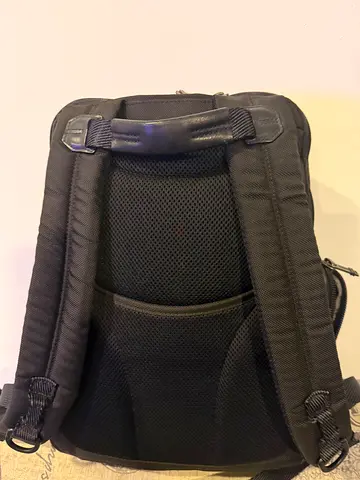 TUMI Black padded travel backpack with ergonomic back support
