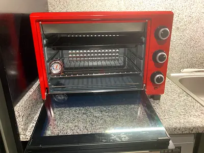 NEW Italian Red countertop electric oven with baking racks, and thermometer - flawless condition.