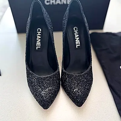 Chanel limited edition heels. Authentic gorgeous black shoes with a subtle shimmering finish.