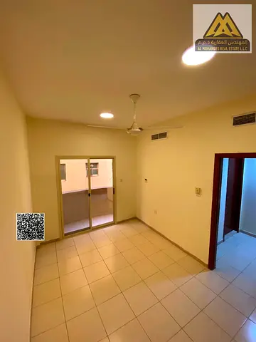 1-bedroom apartment in Al Hamidiya 1 with balcony and central AC. AED 26K yearly, 4 payments, near Ajman University, lowest price, prime location, clo