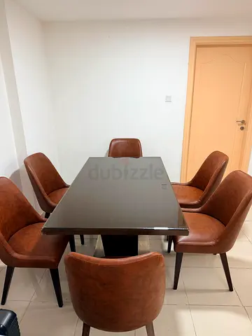 Dining table with 6 brown leather chairs - good condition