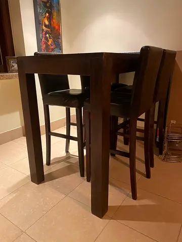 Dark wood bar-height dinner table